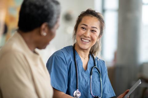 A clinician consults with an older woman