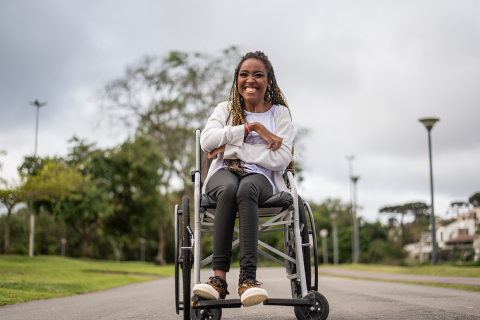 A woman sitting in her wheelchair.