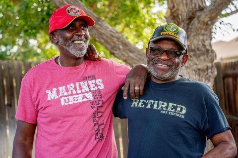 Two Veterans standing next to each other.