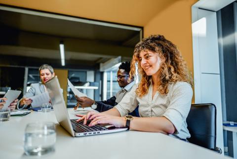 A group of people collaborating together.